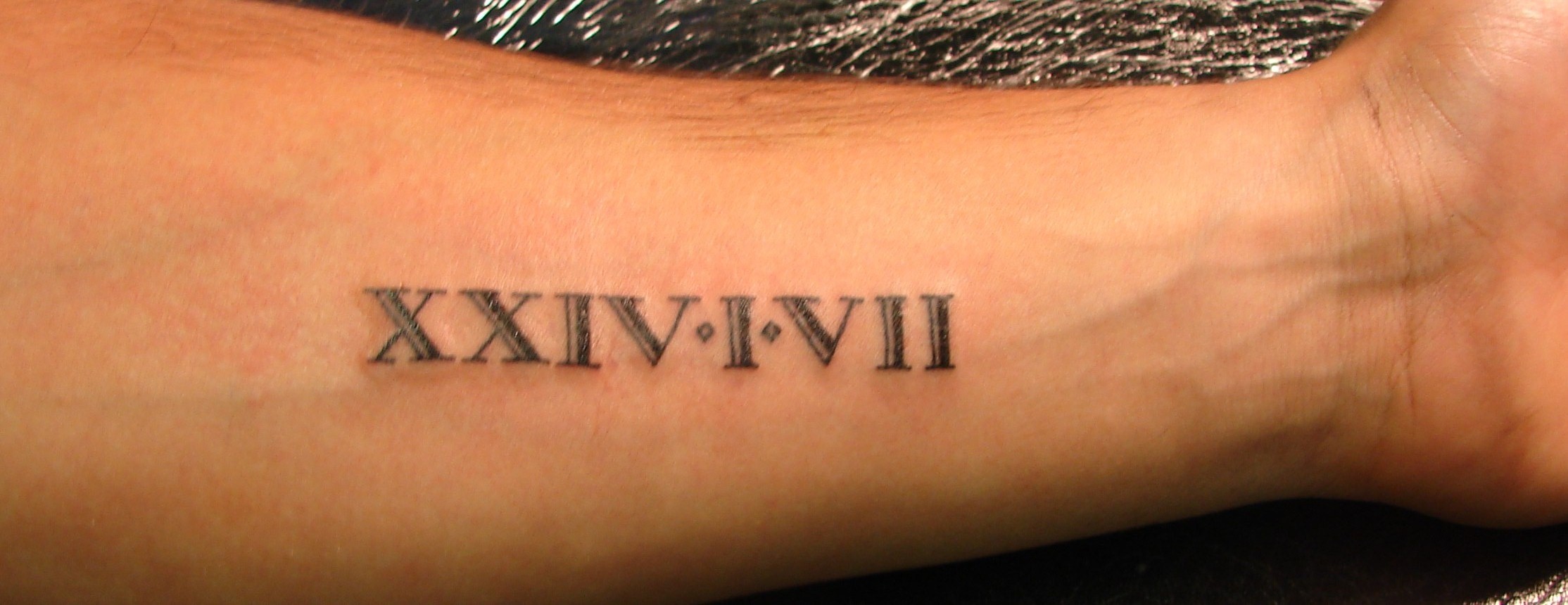 8. Roman Numeral Bicep Tattoo for Women - wide 3