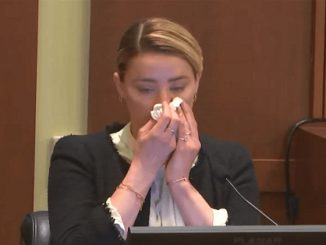 WATCH: Amber Heard Poses While Crying in Court